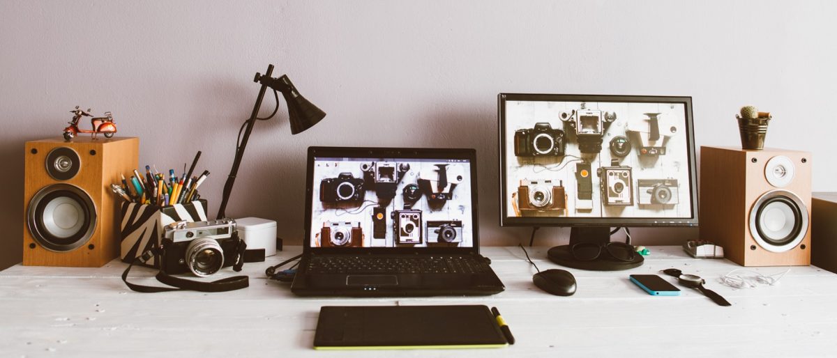 Creative Workspace With Laptop And Monitor