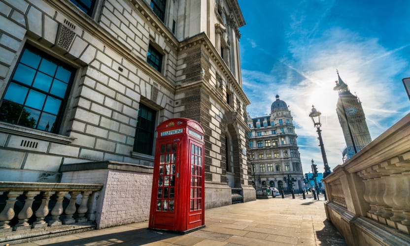 Sunny day in London with an iconic red public phone box