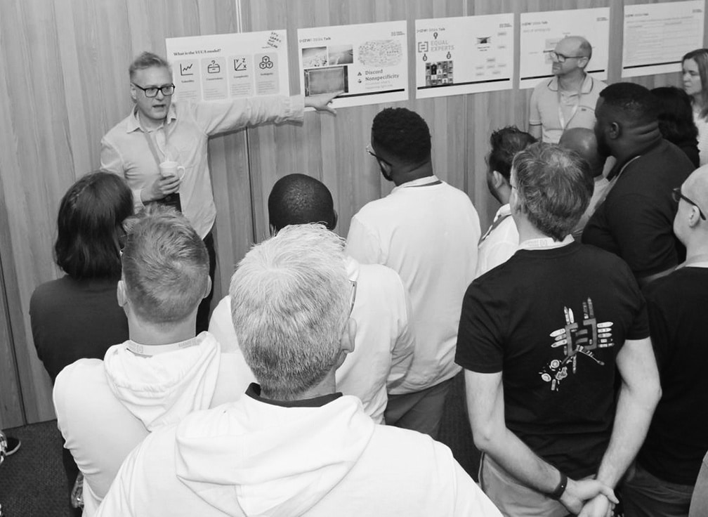 People gathered together for a team standup meeting.