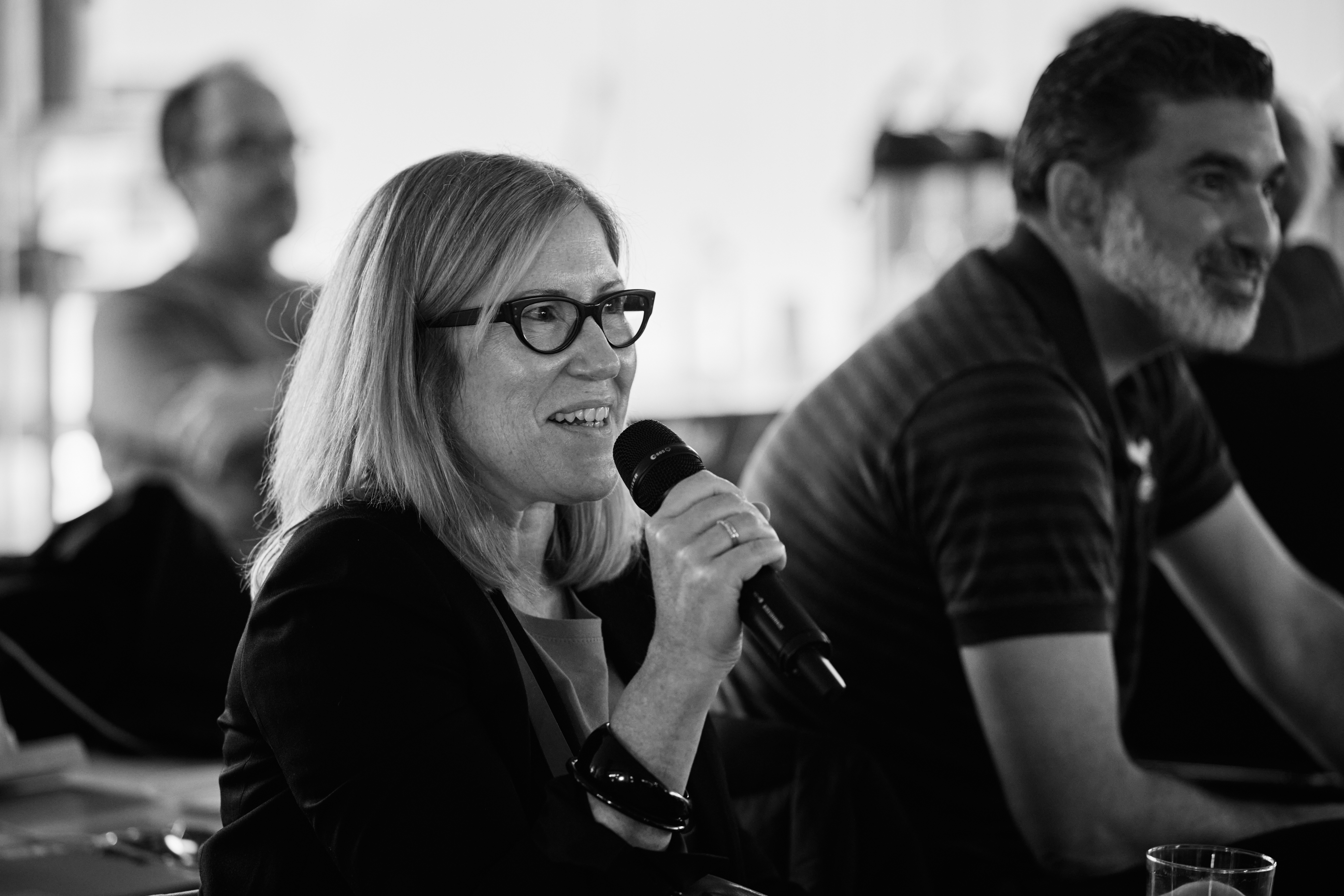 An Equal Experts consultant speaking into a microphone