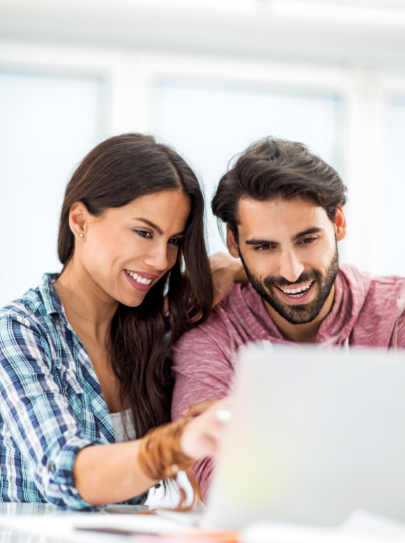 An couple using a laptop to manage their superannuation account