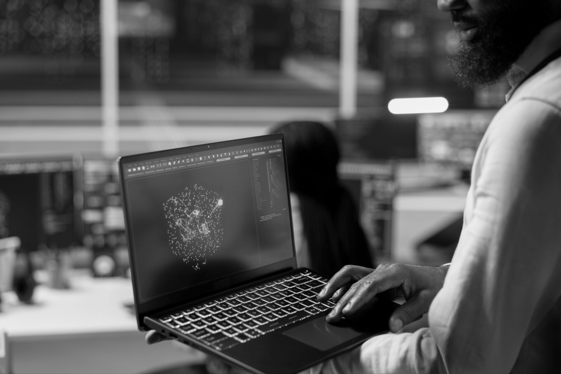 Software engineer reviewing AI-powered platform data on a laptop in a modern technology environment, representing self-service troubleshooting, CI/CD automation and developer enablement through AI agents.