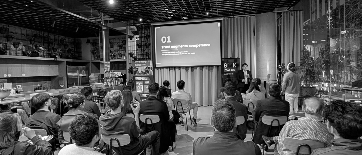 Kevin Ong on stage at G-EE-K Melbourne in July 2026 for his talk on what happened when AI handled incoming patient calls in Australia